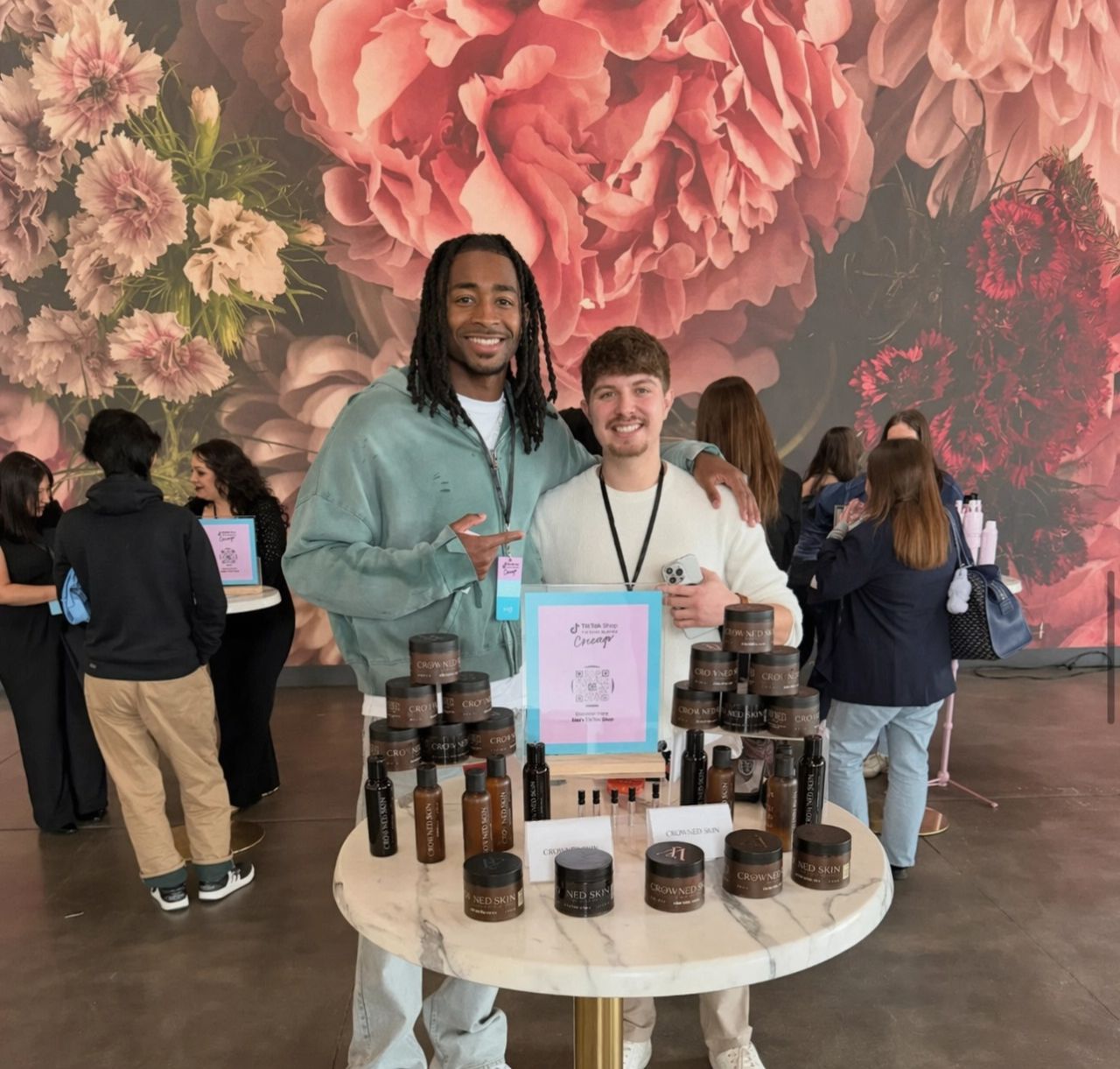 Cole Dockery with Darrell Spencer at TikTok Shop City Tour Chicago — Crowned Skin product display